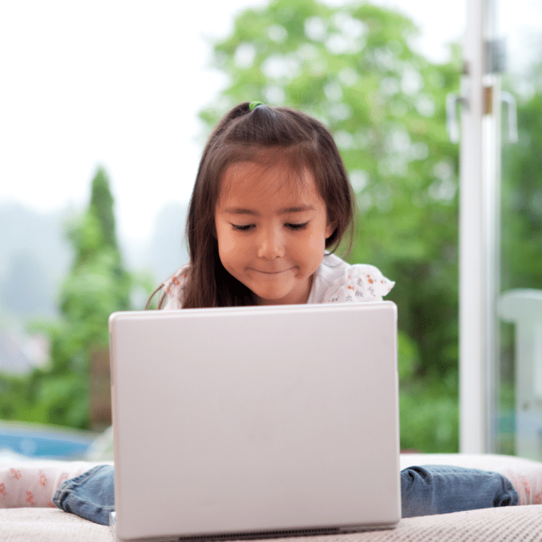 girl doing music lessons on laptop